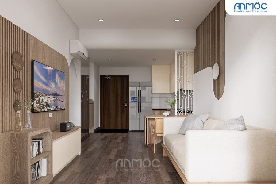 Phòng khách nhìn từ sofa về phía kệ TV treo, lối vào và khu vực bếp