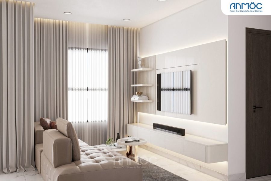 Phòng khách chung cư với bộ sofa dài màu be, kệ TV treo tường màu trắng