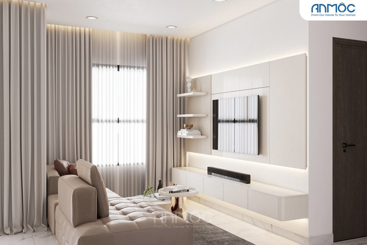 Phòng khách chung cư với bộ sofa dài màu be, kệ TV treo tường màu trắng