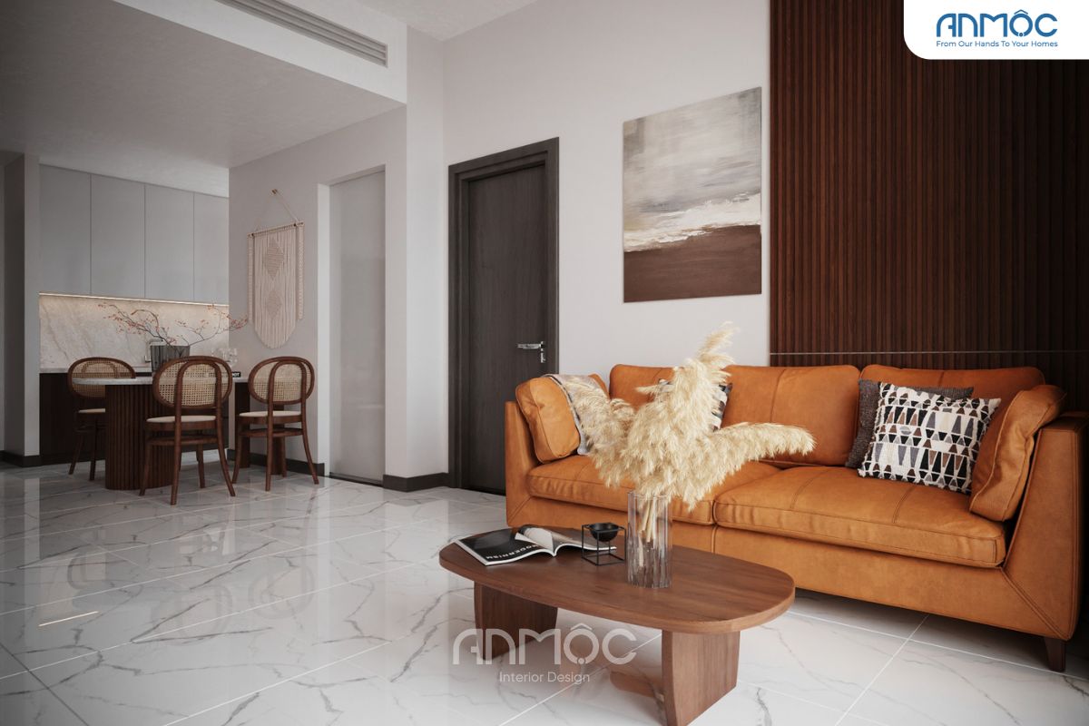Sự kết hợp giữa màu trắng của sàn, màu nâu gỗ của nội thất và màu cam đất của sofa tạo nên không gian hài hòa và hiện đại.