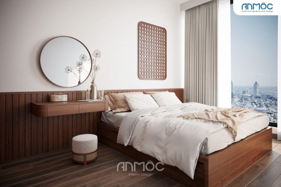 Bàn trang điểm treo tường bằng gỗ mộc mạc với gương tròn không bóng bẩy. Bình hoa gốm thô với cành khô, tượng trưng cho sự trôi chảy của thời gian.