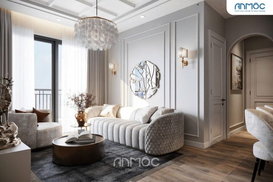 Không gian tiếp khách thanh lịch với sofa bo cong và gương nghệ thuật tạo điểm nhấn.