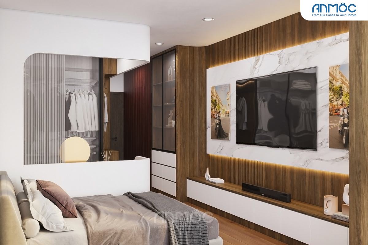 Góc nhìn bao quát từ giường ngủ về phía TV và khu vực tủ quần áo, thể hiện sự liền mạch trong thiết kế nội thất phòng ngủ
