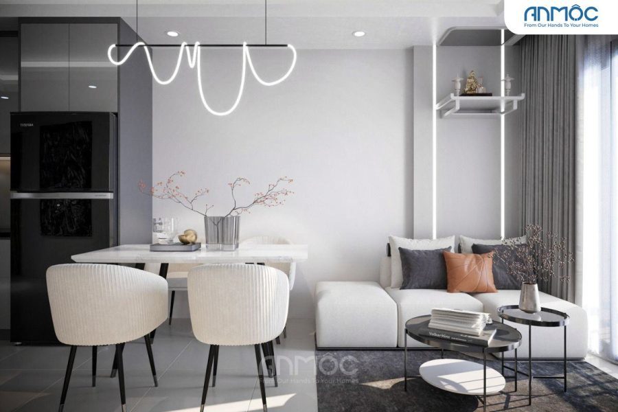 Khu vực phòng ăn và khách liền kề, đèn trần độc đáo, bàn ăn trắng thanh lịch cùng sofa êm ái