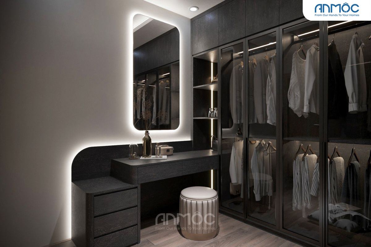 Góc trang điểm tích hợp trong phòng thay đồ, bàn vanity đen, gương đèn LED và ghế đôn tròn hiện đại