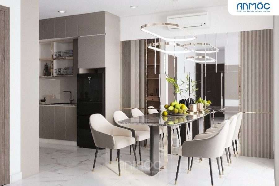 Khu vực ăn uống và bếp được nhìn từ góc rộng, nổi bật bàn ăn đá cẩm thạch sang trọng và ghế bọc nệm kem