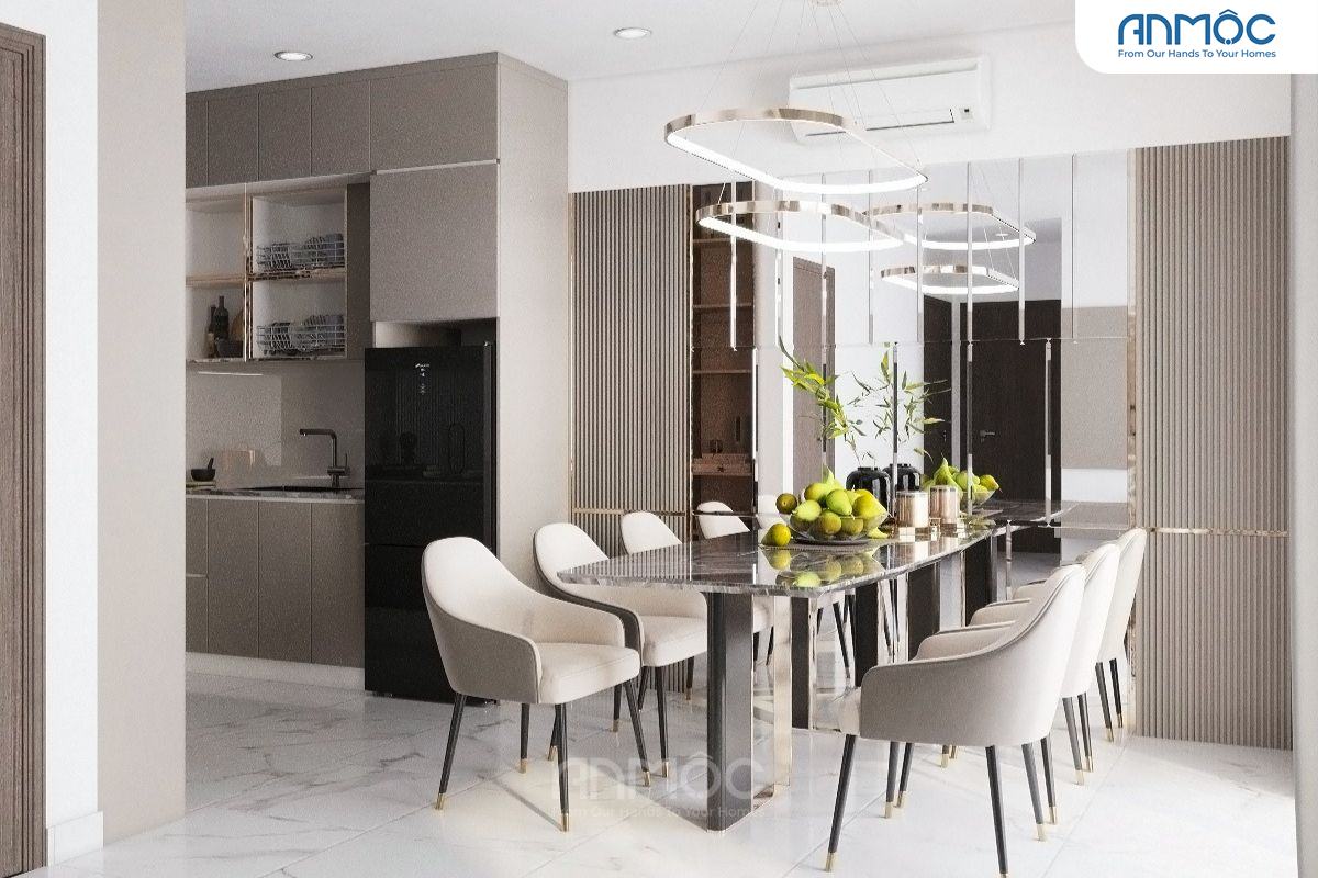Khu vực ăn uống và bếp được nhìn từ góc rộng, nổi bật bàn ăn đá cẩm thạch sang trọng và ghế bọc nệm kem