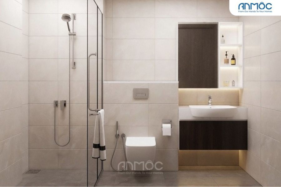Phòng tắm hiện đại và rộng rãi với lavabo âm bàn, gương lớn và vách kính cường lực phân chia khu vực tắm