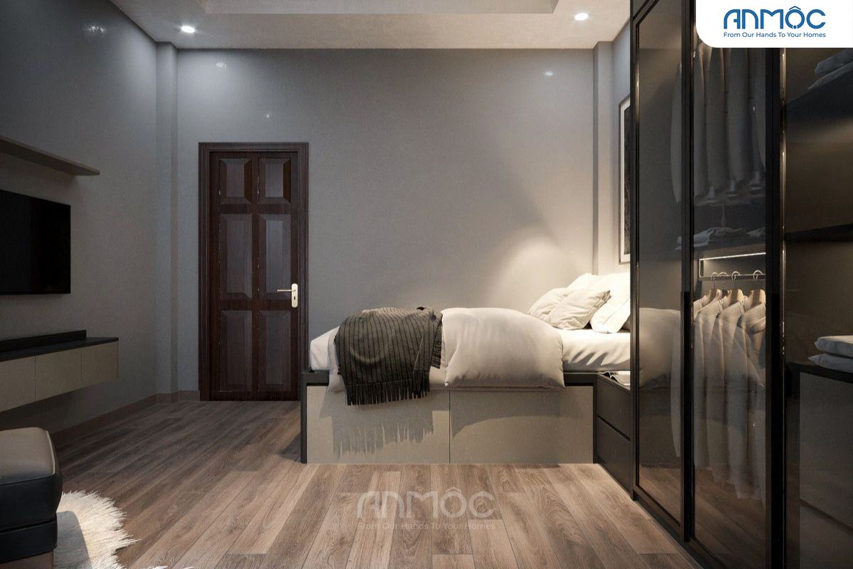 Cận cảnh giường ngủ và cửa ra vào, cho thấy cách bố trí tối ưu không gian nhỏ hẹp của phòng ngủ