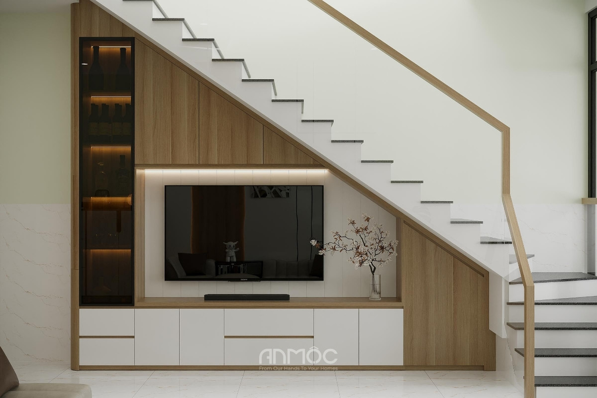 Kệ tủ tivi được thiết kế dưới chân cầu thang, giúp tối ưu diện tích hiệu quả