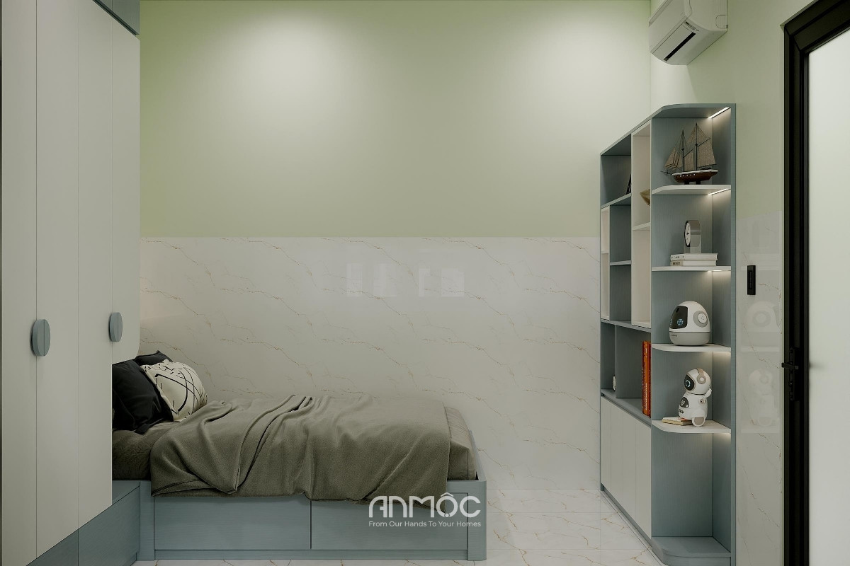 Không gian phòng ngủ được thiết kế đơn giản với màu xanh năng động, tập trung vào sự thoải mái và nghỉ ngơi cho bé trai