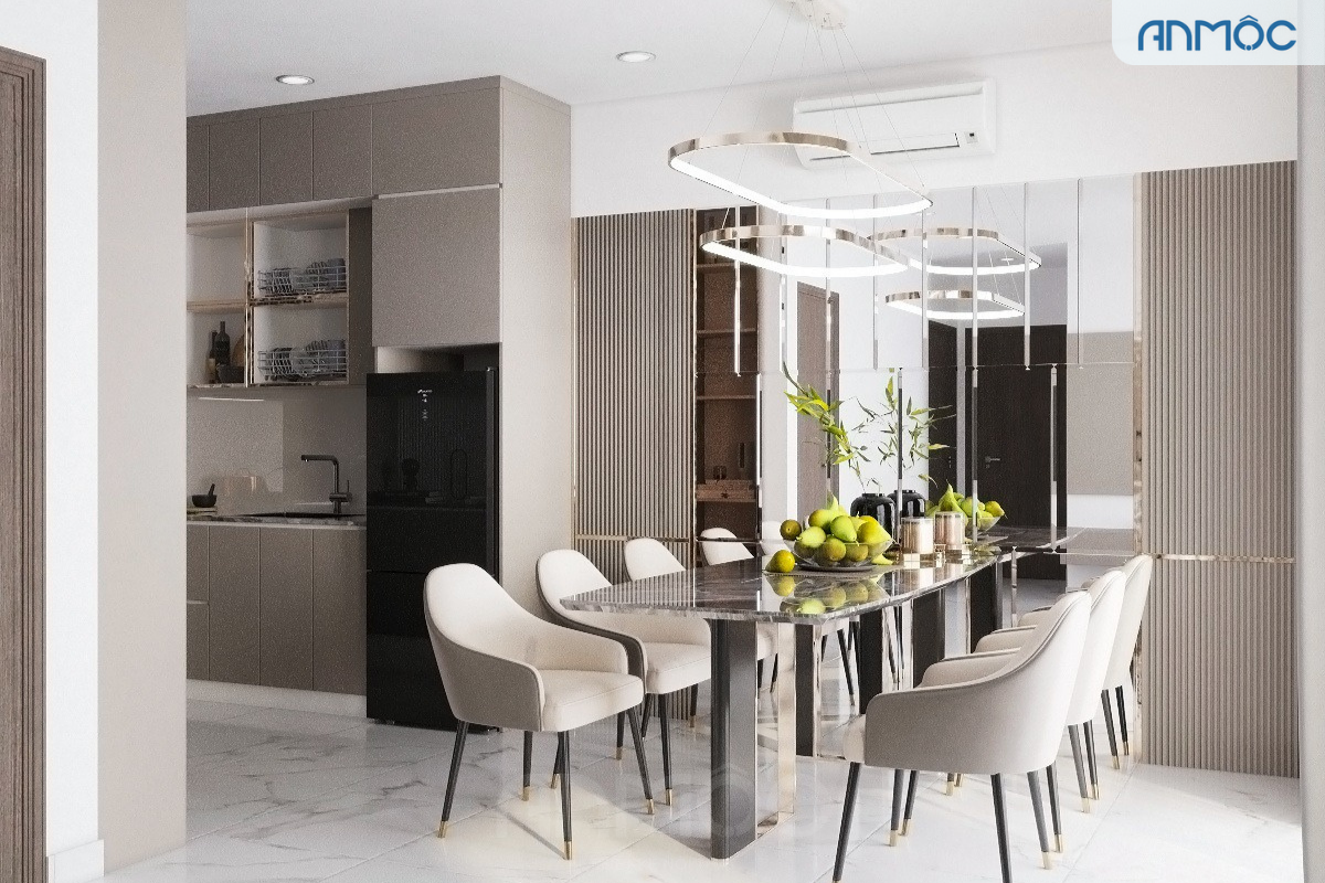 Khu vực ăn uống và bếp được nhìn từ góc rộng, nổi bật bàn ăn đá cẩm thạch sang trọng và ghế bọc nệm kem