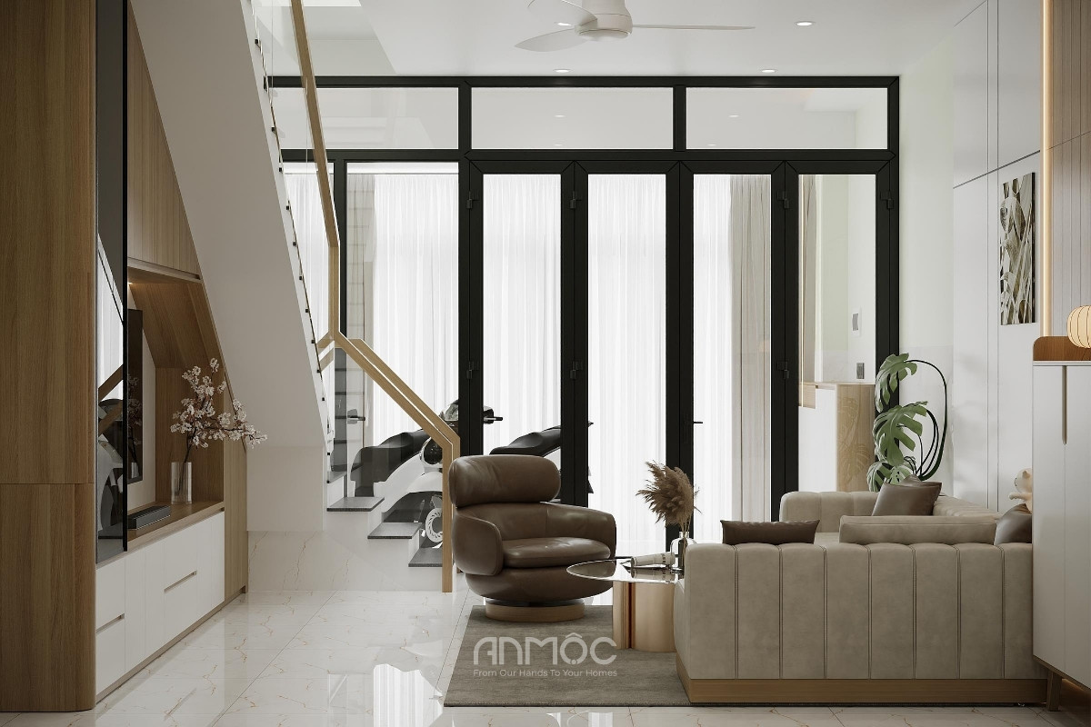 Khu vực cửa chính tận dụng cửa kính lớn để đón sáng tự nhiên, giúp không gian phòng khách luôn thoáng đãng