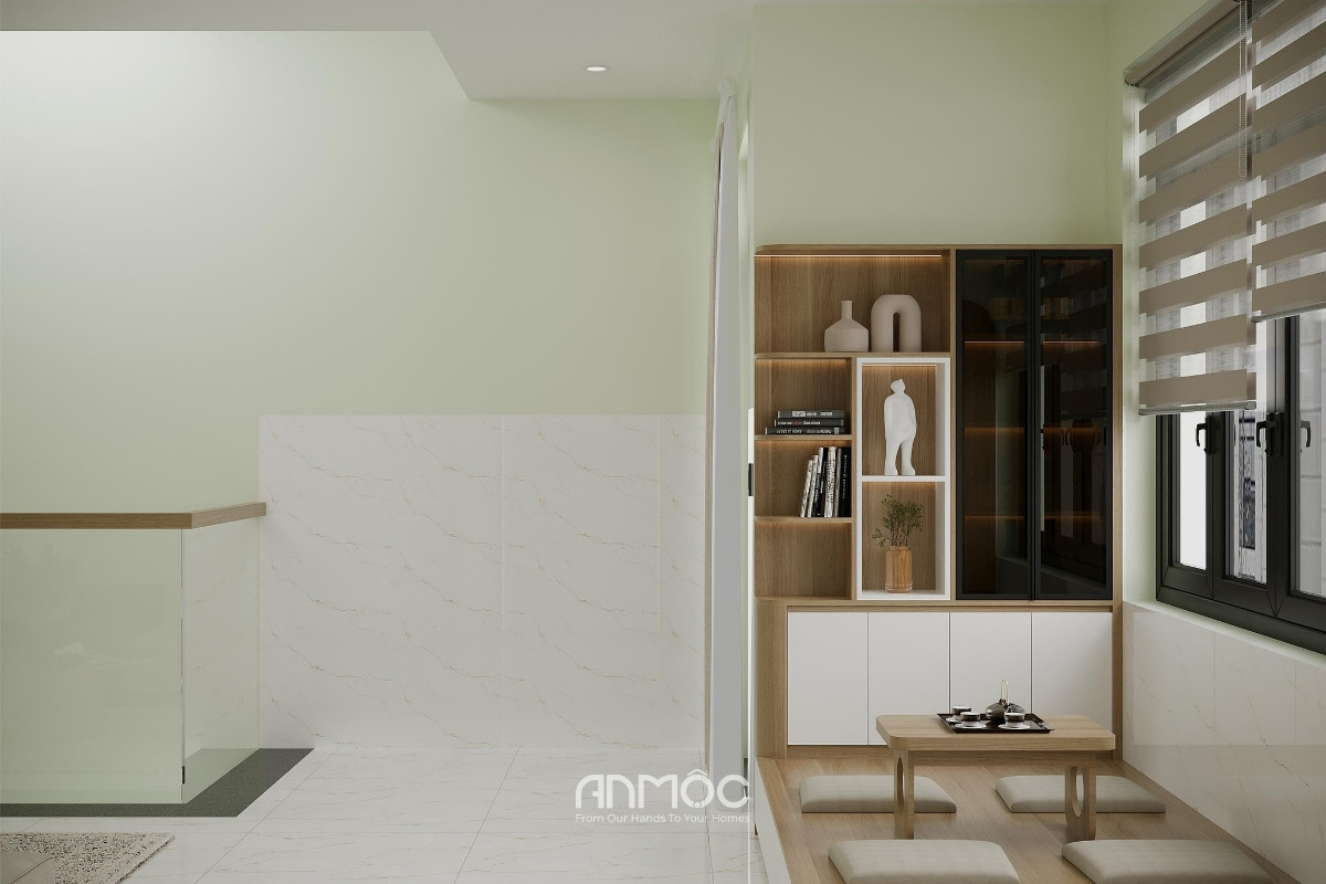 Một góc sinh hoạt nhỏ được bố trí với kệ trang trí kết hợp lưu trữ