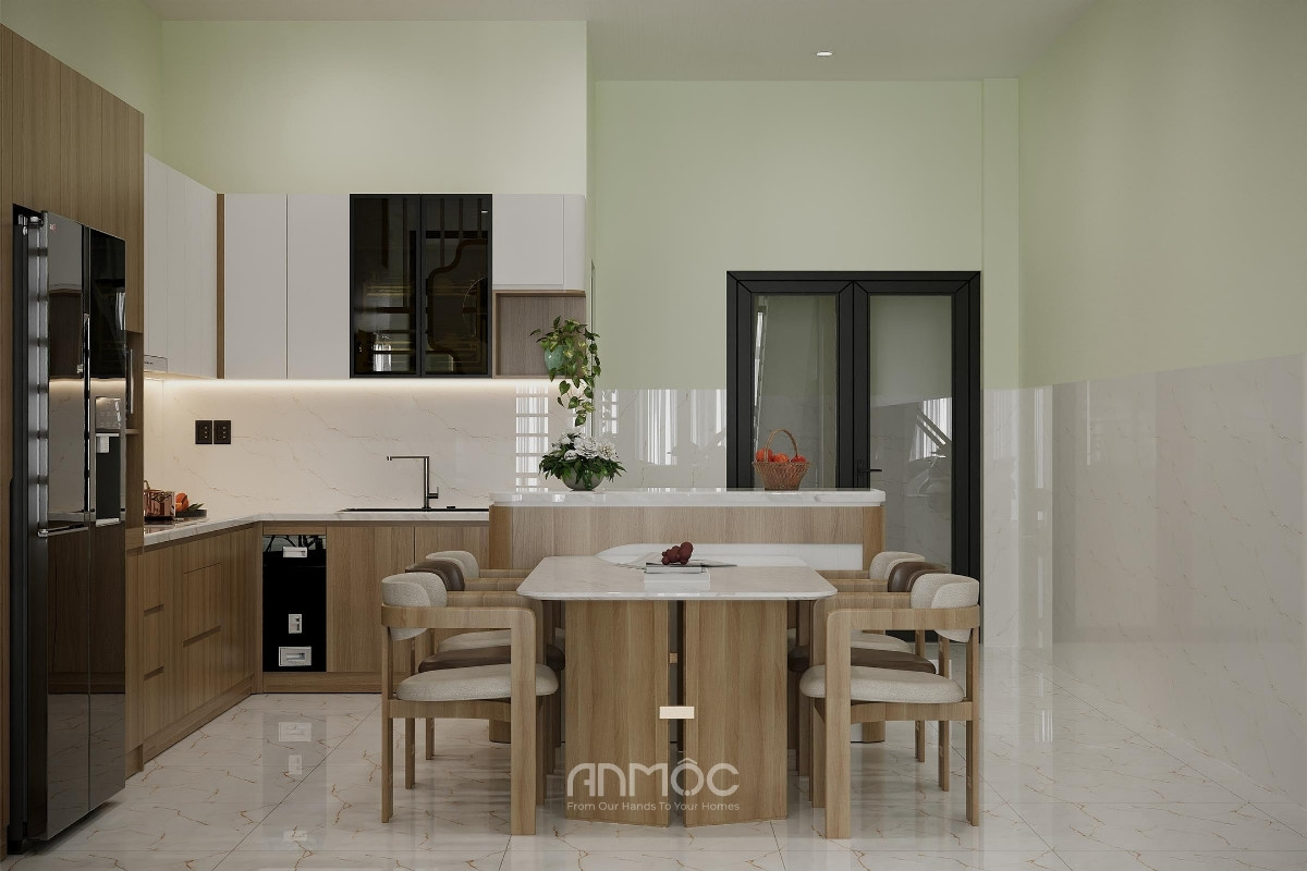 Tổng thể không gian bếp ăn tầng trệt nhà phố Hóc Môn 80m2 được thiết kế gọn gàng với tông màu gỗ sáng, tạo cảm giác ấm cúng cho bữa cơm gia đình