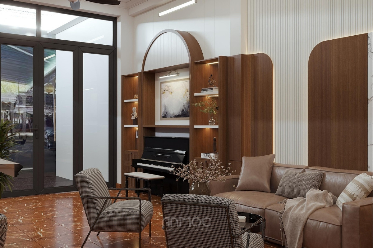 Phòng khách với sofa da, bàn trà, ghế thư giãn và kệ tủ gỗ có khoang để đàn piano