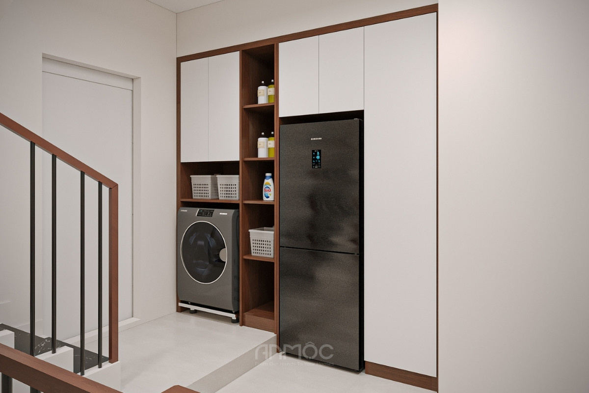 Tủ âm tường ở hành lang tầng 1 được tích hợp máy giặt và tủ lạnh tiện nghi