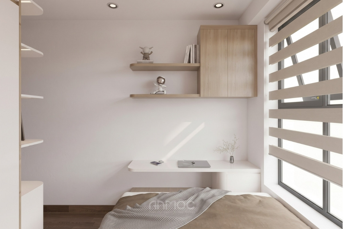 Bàn làm việc được bố trí dưới chân giường với tủ sách treo kèm kệ trang tri